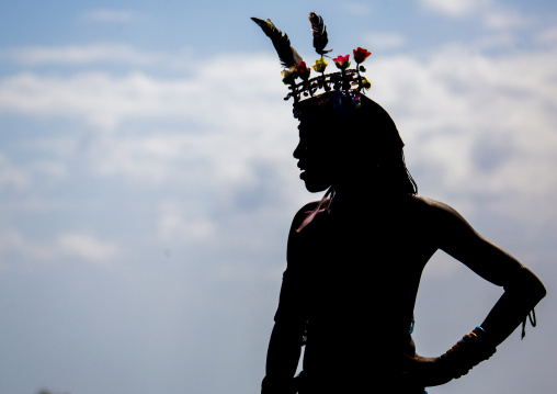 Silhouette of rendille warrior wearing traditional headwear, Turkana lake, Loiyangalani, Kenya