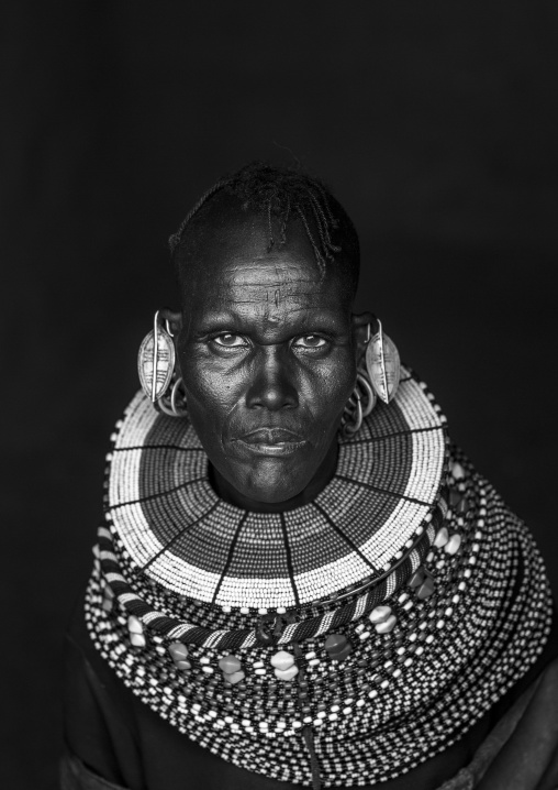 Turkana tribe woman with huge necklaces and earrings, Turkana lake, Loiyangalani, Kenya