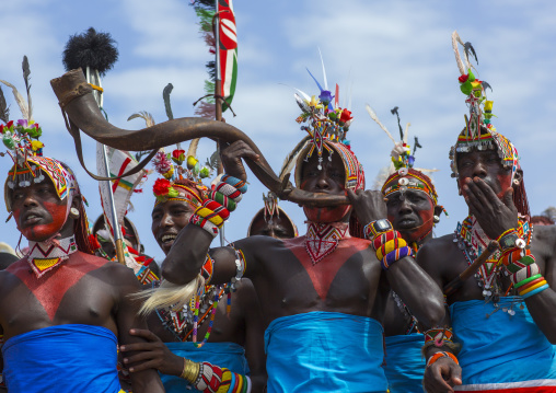 Rendille tribesmen blowing in a horn, Turkana lake, Loiyangalani, Kenya