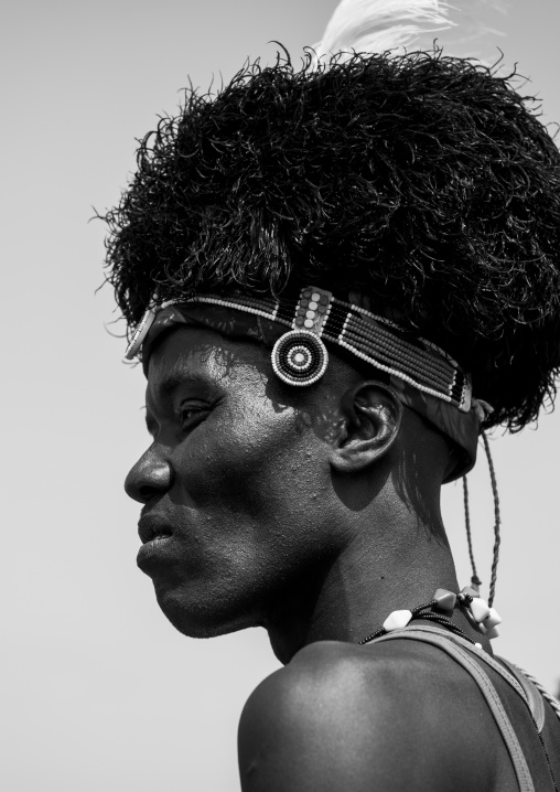 Turkana tribesman with headwear made of ostrich black feathers, Turkana lake, Loiyangalani, Kenya