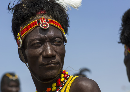 Turkana tribesman with headwear made of ostrich black feathers, Turkana lake, Loiyangalani, Kenya