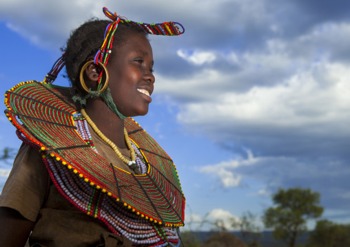 A pokot woman wears large necklaces made from the stems of sedge grass, Baringo county, Baringo, Kenya