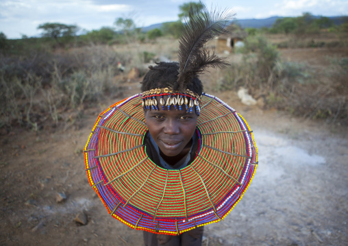 A pokot woman wears large necklaces made from the stems of sedge grass, Baringo county, Baringo, Kenya