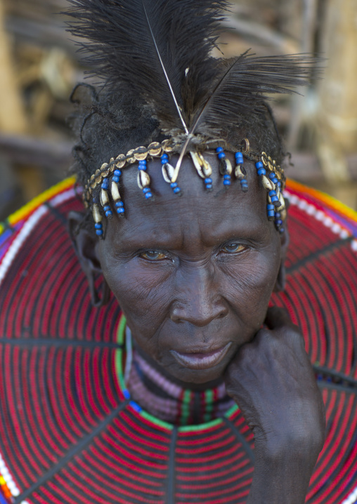 A pokot woman wears large necklaces made from the stems of sedge grass, Baringo county, Baringo, Kenya