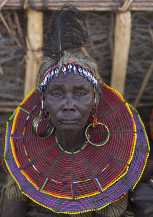 A pokot woman wears large necklaces made from the stems of sedge grass, Baringo county, Baringo, Kenya