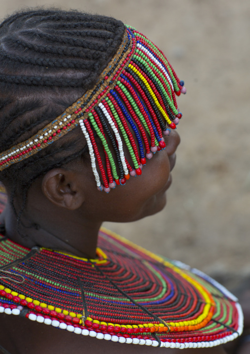 A pokot woman wears large necklaces made from the stems of sedge grass, Baringo county, Baringo, Kenya