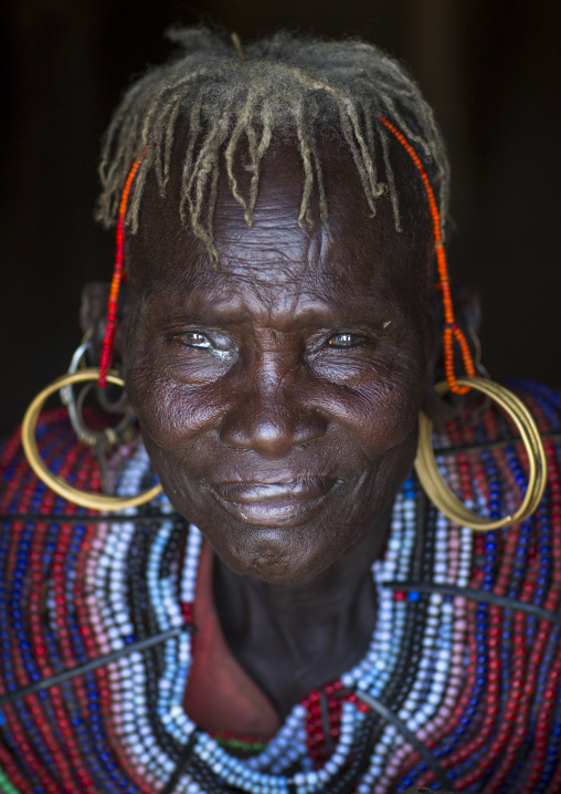 A pokot woman wears large necklaces made from the stems of sedge grass, Baringo county, Baringo, Kenya