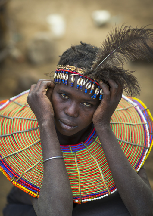 A pokot woman wears large necklaces made from the stems of sedge grass, Baringo county, Baringo, Kenya