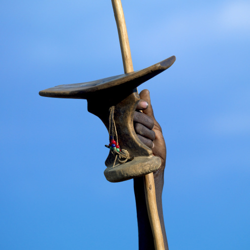 Pokot tribe man with a wooden headrest and a spear, Baringo County, Baringo, Kenya