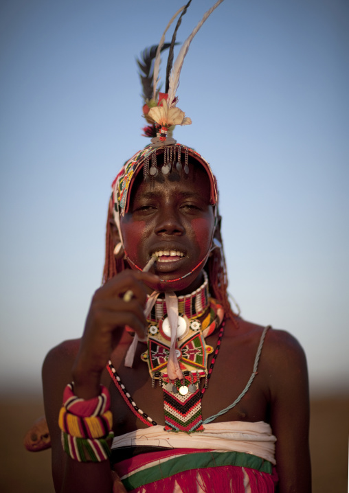 Portrait of a Rendille tribe moran with a headwear, Rift Valley Province, Turkana lake, Kenya