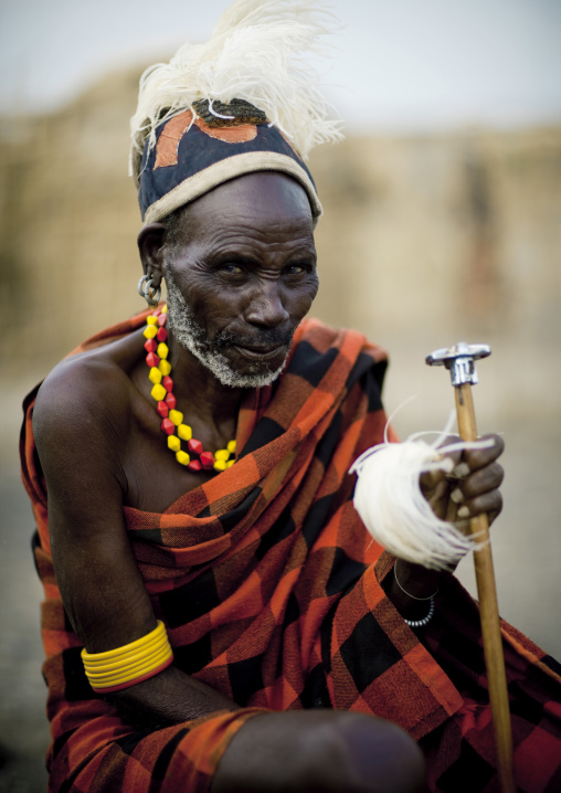 Portrait of a Turkana tribe man with ostrich feathers on the headwear, Rift Valley Province, Turkana lake, Kenya