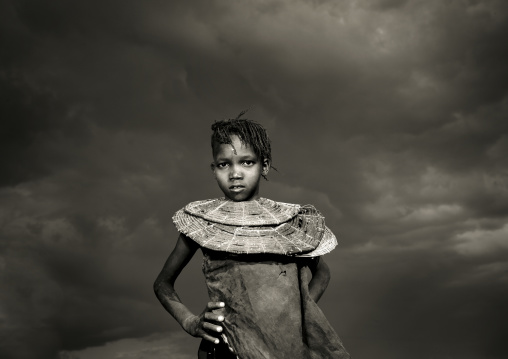 A pokot girl wears large necklaces made from the stems of sedge grass, Baringo county, Baringo, Kenya