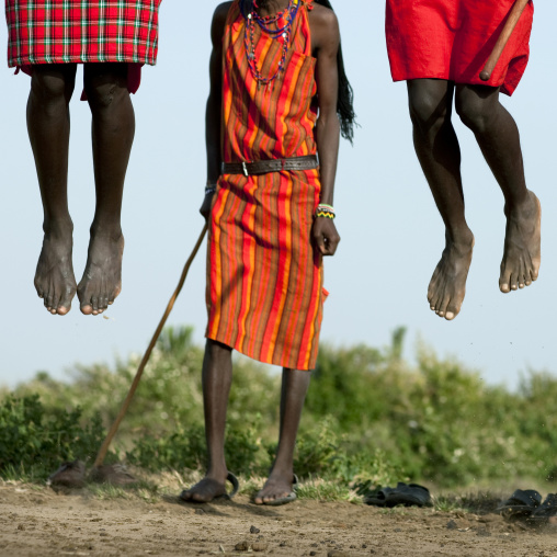 Maasai tribe men jumping during a ceremony, Rift Valley Province, Maasai Mara, Kenya