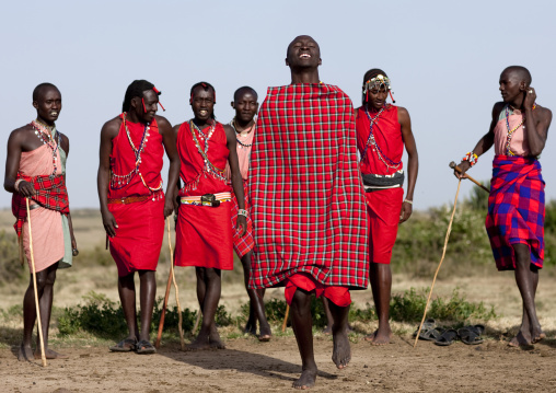 Maasai tribe men jumping during a ceremony, Rift Valley Province, Maasai Mara, Kenya