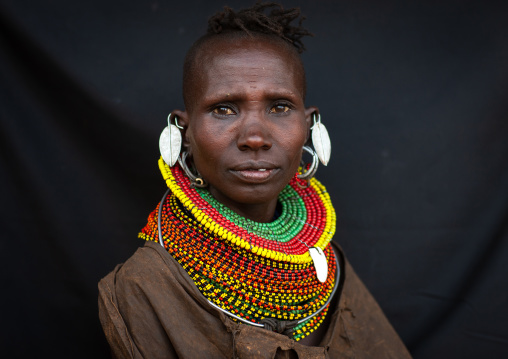 Portrait of a Turkana tribe woman with large earrings and necklaces, Rift Valley Province, Turkana lake, Kenya