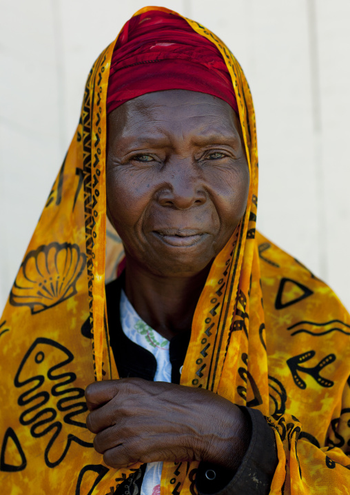 Swahili woman wearing yellow veil, Lamu County, Lamu, Kenya