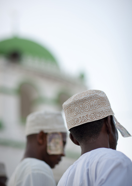 Muslim men with bank notes under their kofias during Maulid festival, Lamu County, Lamu, Kenya