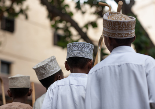 Muslim children dancing with sticks during Maulid festival, Lamu County, Lamu, Kenya