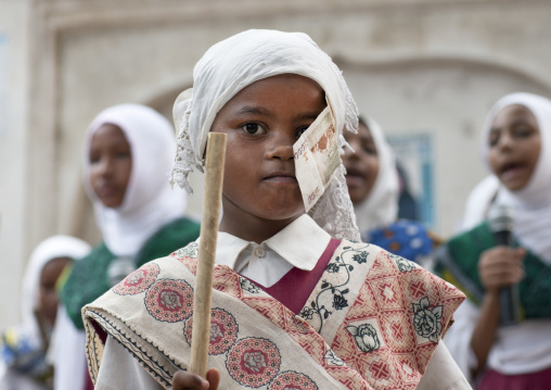 Young muslim girl with bank notes on her head during Maulid festival, Lamu County, Lamu, Kenya