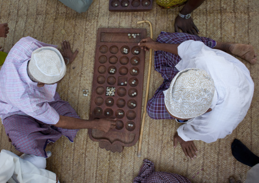 Players of bao in the street, Lamu County, Lamu, Kenya