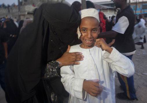 Muslim boy with bank notes under his kofia during Maulid festival, Lamu County, Lamu, Kenya