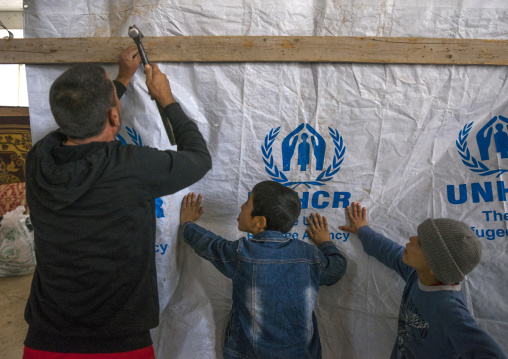 Yazidi Refugees From Sinjar Building A Shelter In An Under Construction Building, Duhok, Kurdistan, Iraq