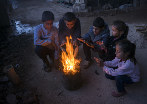 Yazidi Refugees Children Displaced From Sinjar Making Fire In An Under Construction Building, Duhok, Kurdistan, Iraq