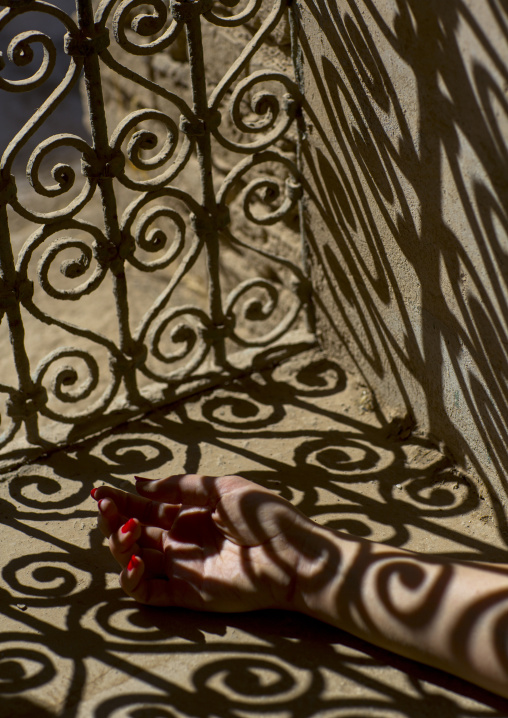 Woman Hand In The Shadow Of A Wrought Iron Window In The Citadel, Erbil, Kurdistan, Iraq