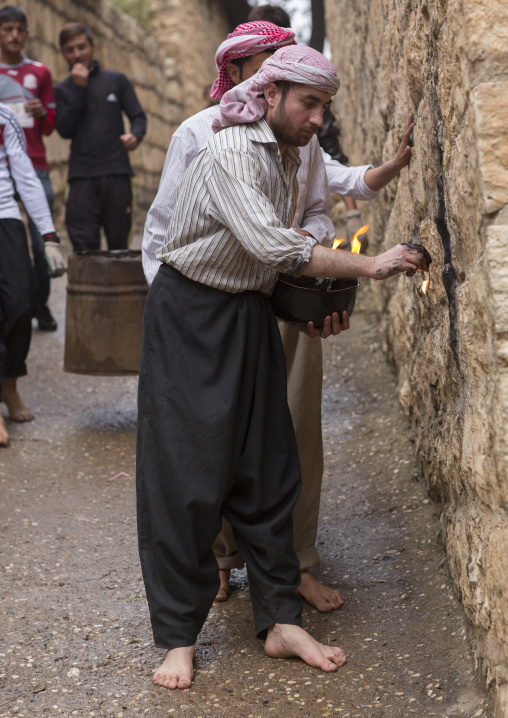 Yezedi Fakirs Lighting Sacred Fire In The Streets,  In Lalesh Temple, Kurdistan, Iraq