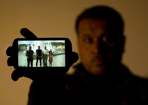 Yezedi Refugee From Sinjar Showing A Relative Killed By Daesh On His Mobile Phone, Zohar, Kurdistan, Iraq