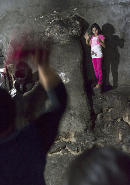 Yazidi Woman Throwing Scarf On Sacred Stone, Temple City Of Lalesh, Kurdistan, Iraq