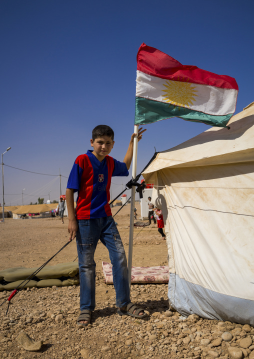 Syrian Refugee Child With A Barcelona Shirt In Front Of His Tent, Erbil, Kurdistan, Iraq