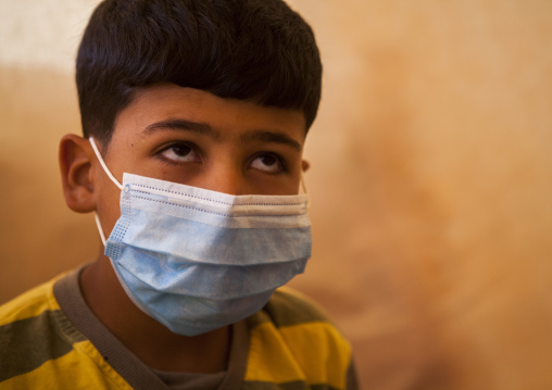 Ill Young Boy With A Mask In A Syrian Refugee Camp, Erbil, Kurdistan, Iraq