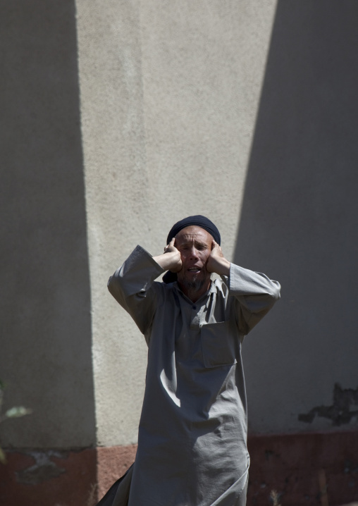 Muslim Man Praying In Kyzart Village, Kyrgyzstan