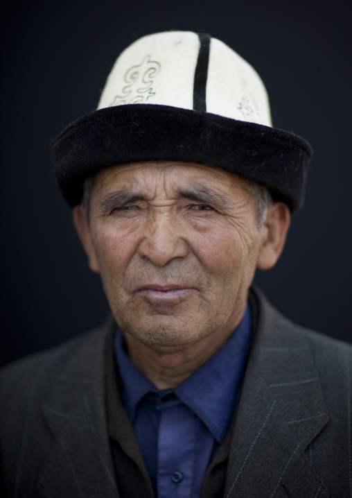 Old Man Wearing A Kalpak Hat At The Animal Market Of Kochkor, Kyrgyzstan