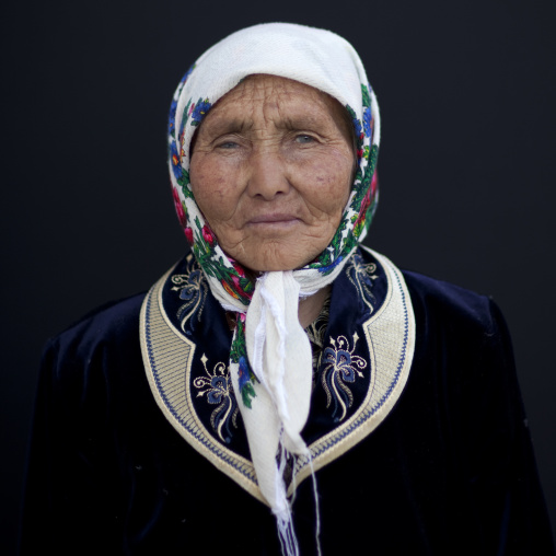 Old Woman Wearing A Headscarf At The Animal Market Of Kochkor, Kyrgyzstan