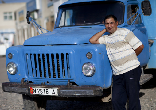 Man Leaning On The Hood Of A Truck, Kochkor, Kyrgyzstan