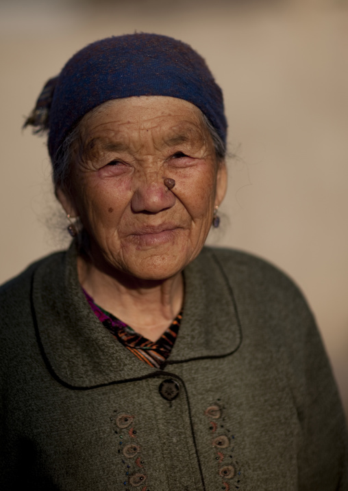 Old Woman With Headscarf In Kochkor, Kyrgyzstan