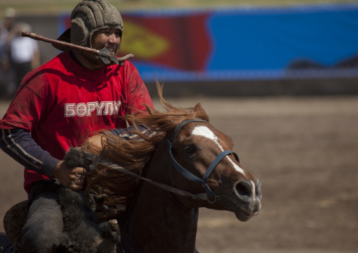 Horseman Carrying A Goat Carcass For A Horse Game On National Day, Bishkek, Kyrgyzstan