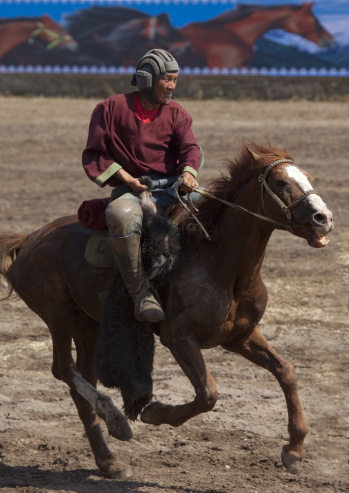 Horseman Carrying A Goat Carcass For A Horse Game On National Day, Bishkek, Kyrgyzstan