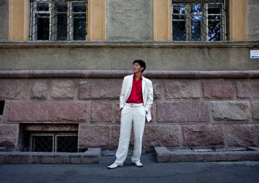 Elegant Man In A White Suit In The Streets Of Bishkek, Kyrgyzstan