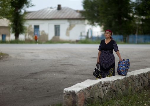 Woman With A Headscarf In Kochkor, Kyrgyzstan