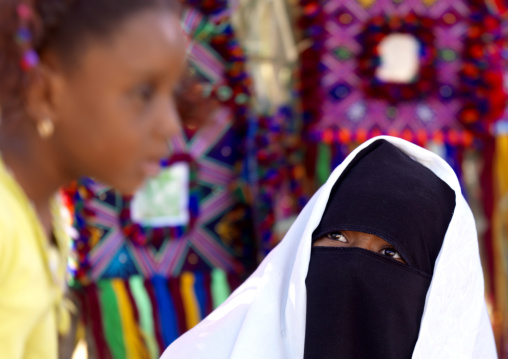 Woman in burqa with her daughter, Tripolitania, Ghadames, Libya