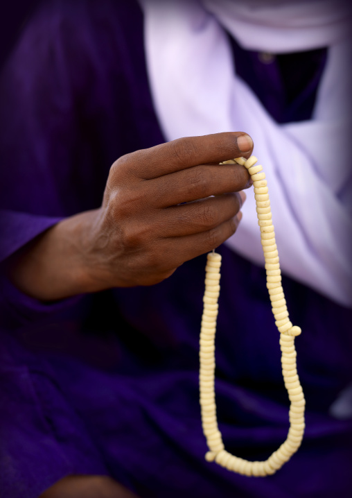 Tuareg man praying with beads, Fezzan, Umm al-Maa, Libya