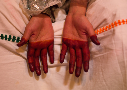 Tuareg girl in traditional clothing showing her hand with henna, Tripolitania, Ghadames, Libya