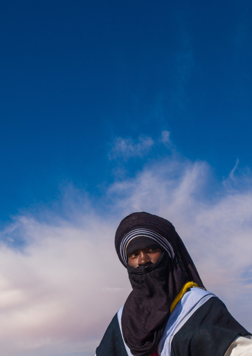 Portrait of a tuareg man  in traditional clothing against the sky, Tripolitania, Ghadames, Libya