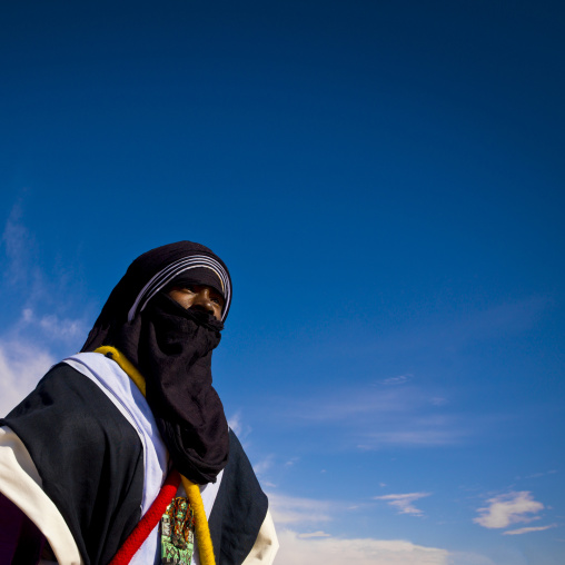 Portrait of a tuareg man  in traditional clothing against the sky, Tripolitania, Ghadames, Libya