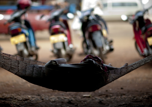 Woman sleeping in a hamac, Pakse, Laos