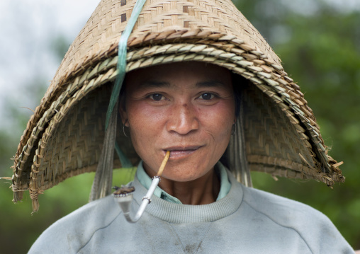 Khmu minority woman smoking pipe, Xieng khouang, Laos