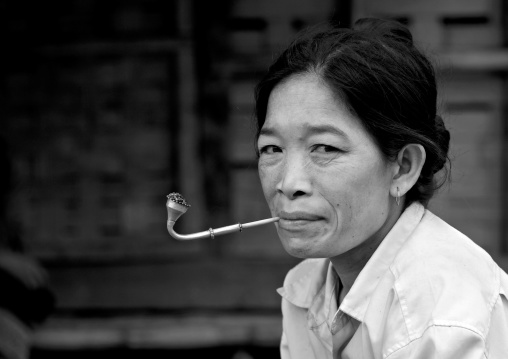 Khmu minority woman smoking pipe, Xieng khouang, Laos